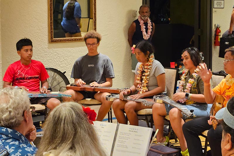 NextGen Enosa, Pono, Isabella, and Makamae at a 2023 Kona Steel Guitar Festival kanikapila