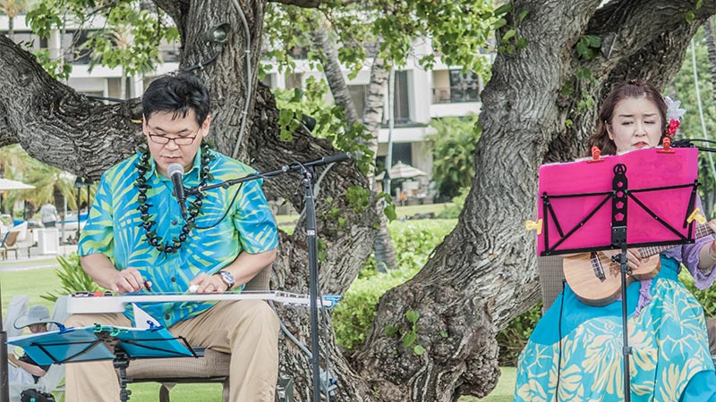 Shinichi and Kumiko performing on the 2017 Hawai&lsquo;i Island Steel Guitar Experience Open Stage